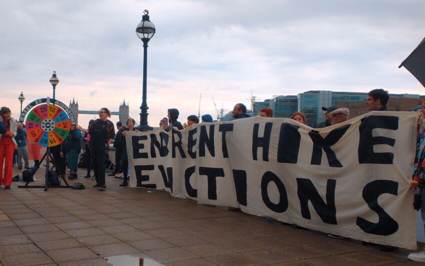 Tenant unionists with banner saying 'end rent hike evictions'